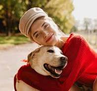 A smiling woman and a dog after a specialized PSA training in Georgia